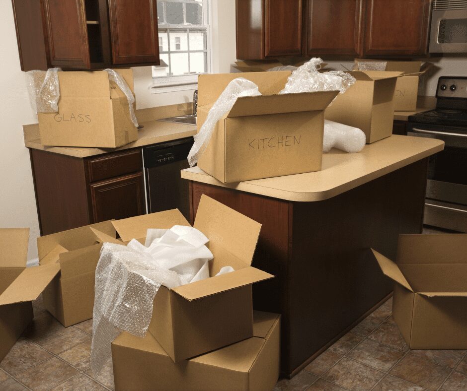 boxes scattered around the kitchen