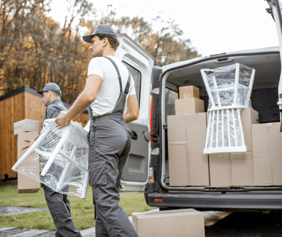 moving crew unloading chair from the van